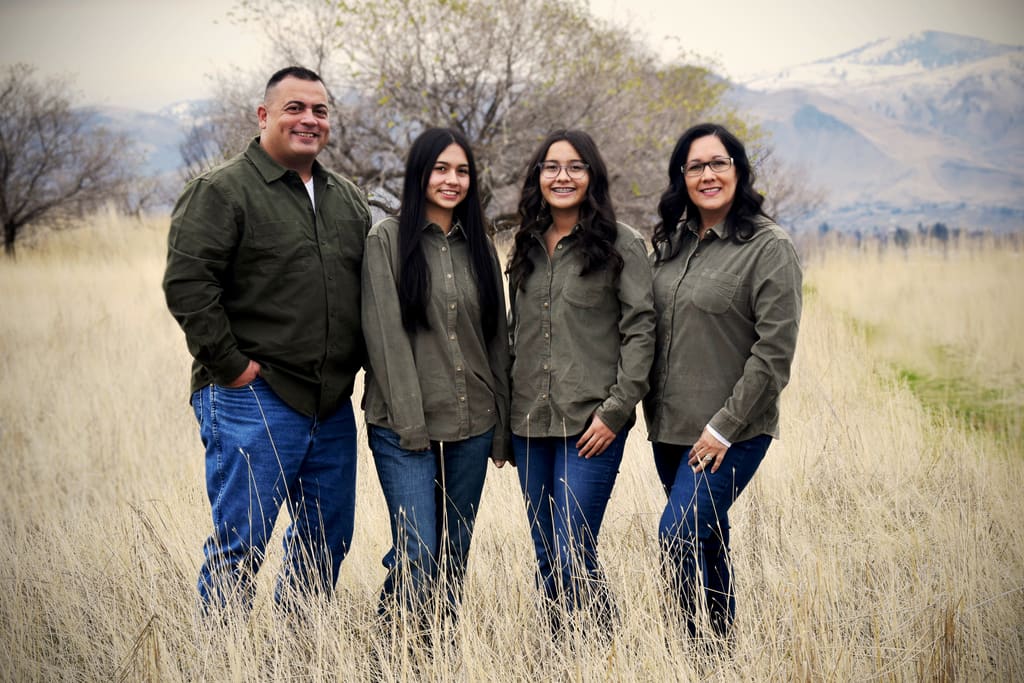 Adam Musgrove and family in Douglas County landscape.