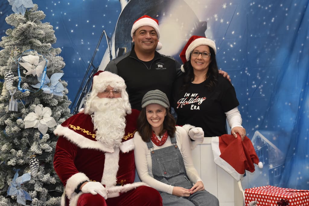 Adam Musgrove and family at a Santa's Stars community holiday outreach event.
