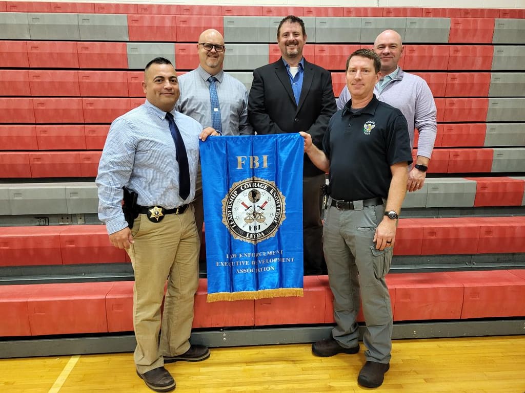Adam Musgrove with law enforcement leadership group at an FBI LEEDA event.
